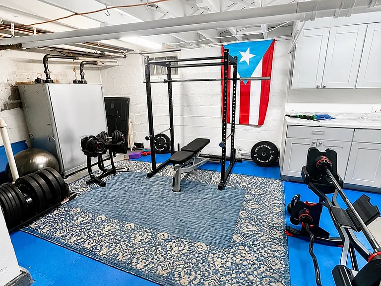 Basement storage & gym area.