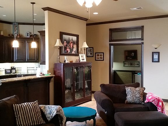 Standing at fireplace