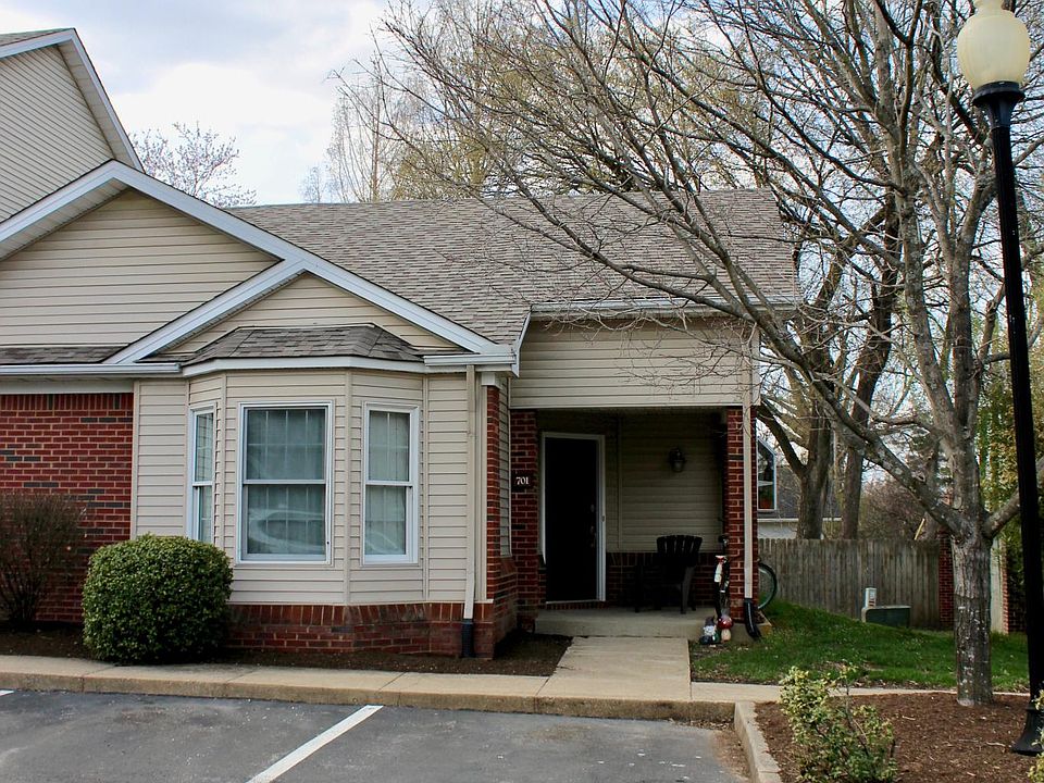 Corner unit with private side yard and reserved parking right in front of unit.