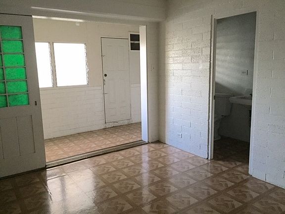 Bedroom, view into enclosed lanai