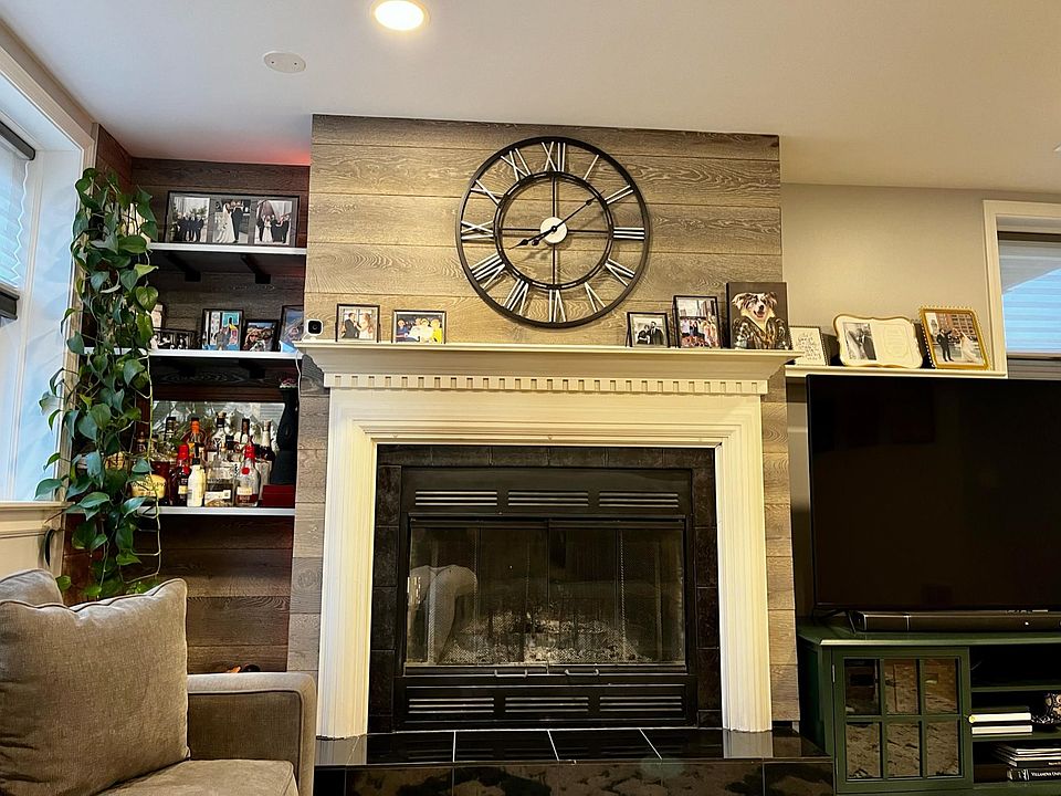Natural wood fireplace, built-in shelving