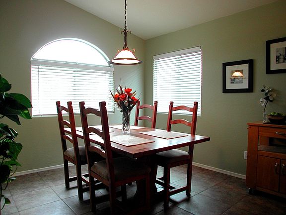 Dining area, also with vaulted ceilings and upgraded 18 inch tile