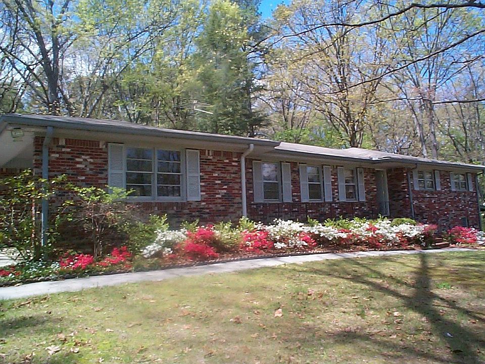 FRONT VIEW OF THIS 4 SIDED BRICK RANCH