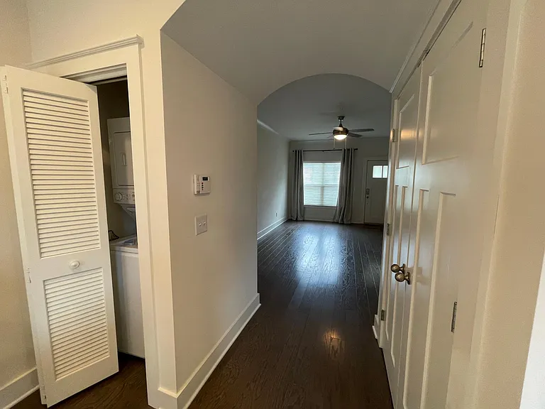 Washer and dryer will remain. View into the living room with large window for natural light