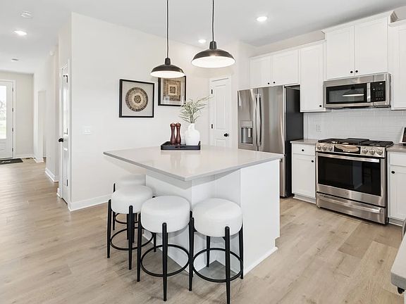 Kitchen with quartz countertops and matte black hardware