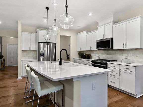 The Braddock spacious kitchen with an island is a culinary haven, boasting abundant room for meal pr