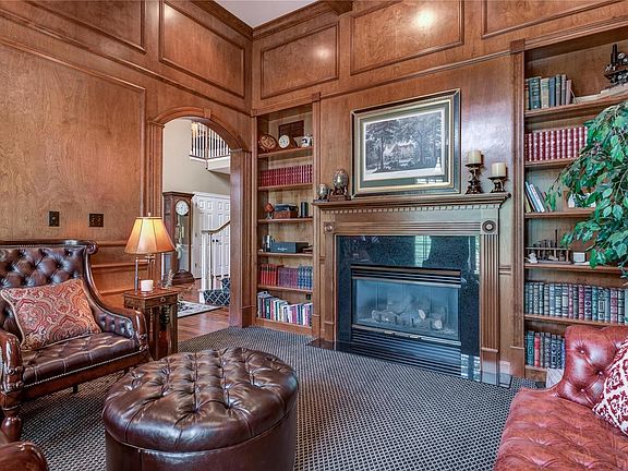Another view of the library with gas fireplace and charming built-in bookcases - great get-away space