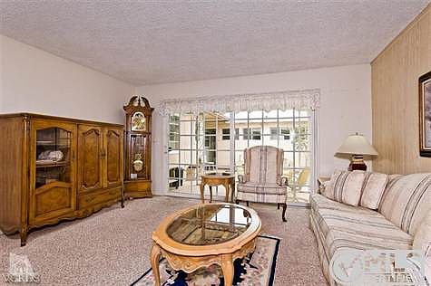 Living room has an attached dining area.