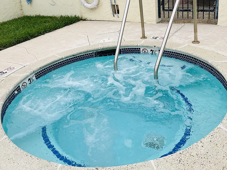 Inviting clear spa in private area at Plaza Verde Apartments in Escondido, California.