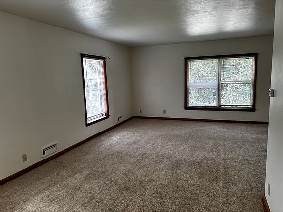 Another view of living room plus dining area