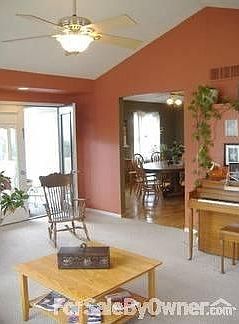 Living Room into Dining Area : You can see the open door to the screened in porch.