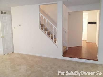 Laminate foyer
						:
						View from side of living room.