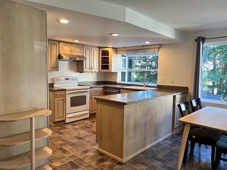 Additional updates include a newer dishwasher, range hood and refrigerator.