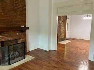 Open concept living room/dining room with beautiful hardwood floors