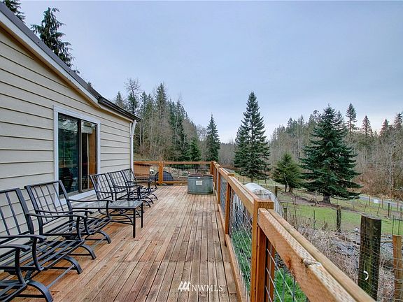 Deck expands along front of home enjoying the territorial views