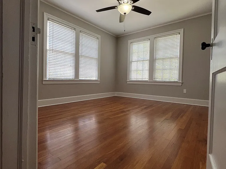 Bedroom w/ walk in closet with "California closet"