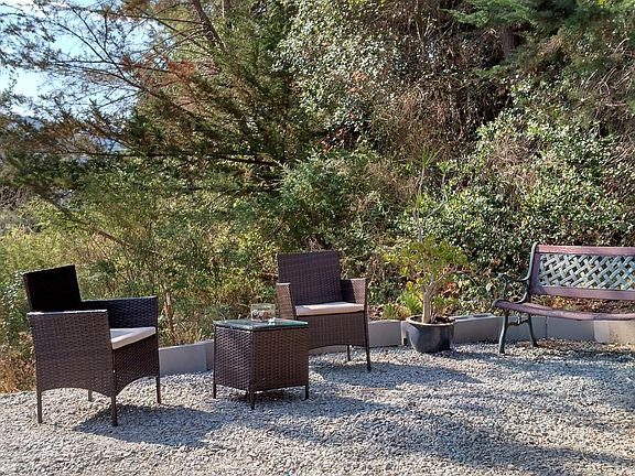 Patio with a bench and bistro. Nice shady spot. 120 sq ft