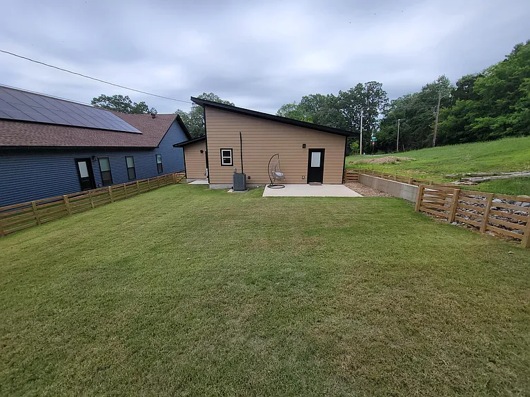 A view of the backyard looking towards the rear of the home.