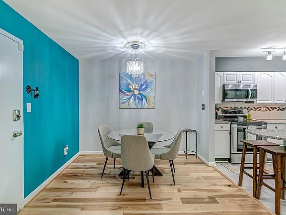 Open layout with dining room, kitchen and living room including hardwood floors