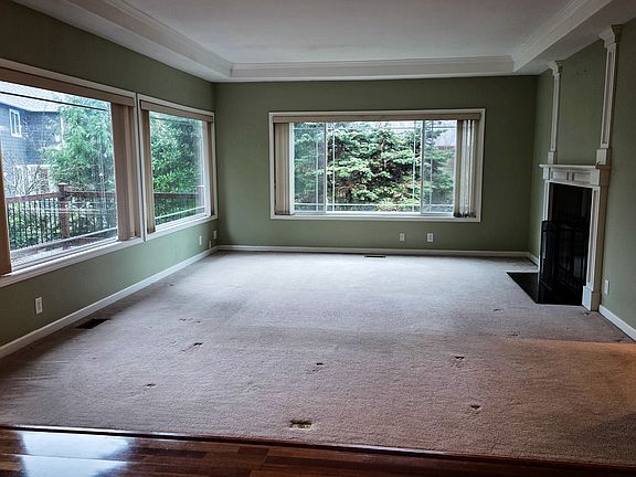 Spacious living are with large windows that fill the room with natural light