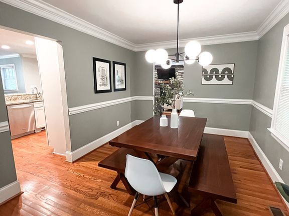 Formal dining area with access to front living room, kitchen and back living room.
