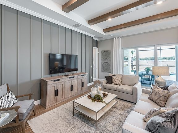 Spacious gathering room with sliding glass doors with lanai access