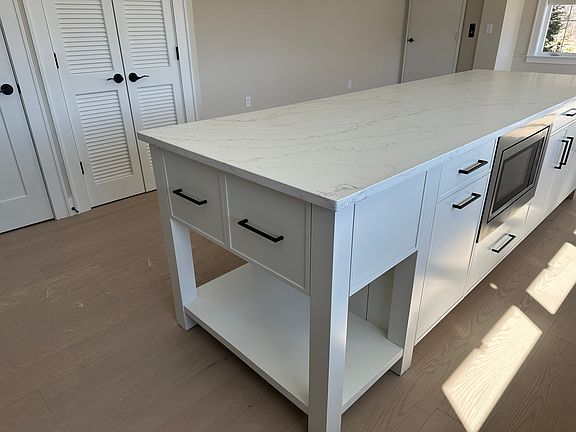 Granite Countertops with ample storage drawers.