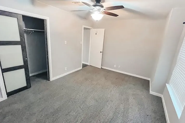 1st bedroom (2nd largest in the house) semi- walk-in closet with fashionable sliding pocket doors