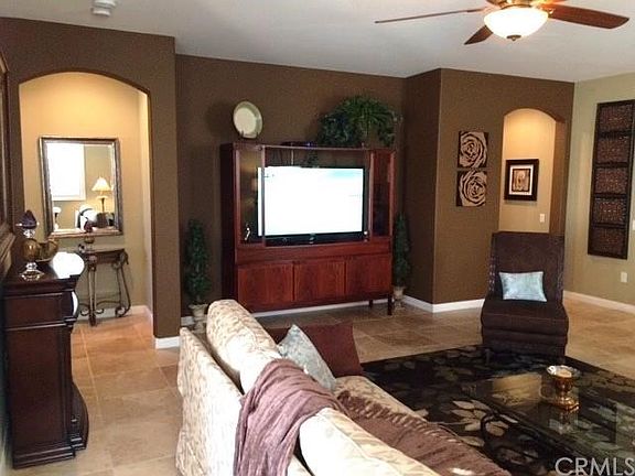 Living room with large 55" flatscreen, electric fireplace, a