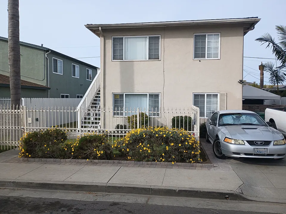 Front of building, unit is downstairs, and there is a locked security gate in front