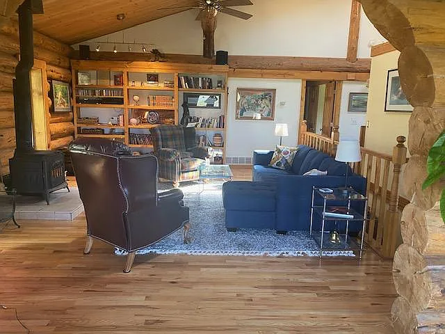 standing in sunroom looking into living room