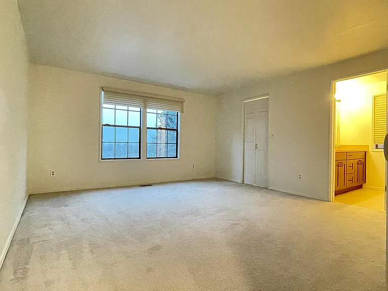 Spacious primary bedroom with WIC and private bathroom