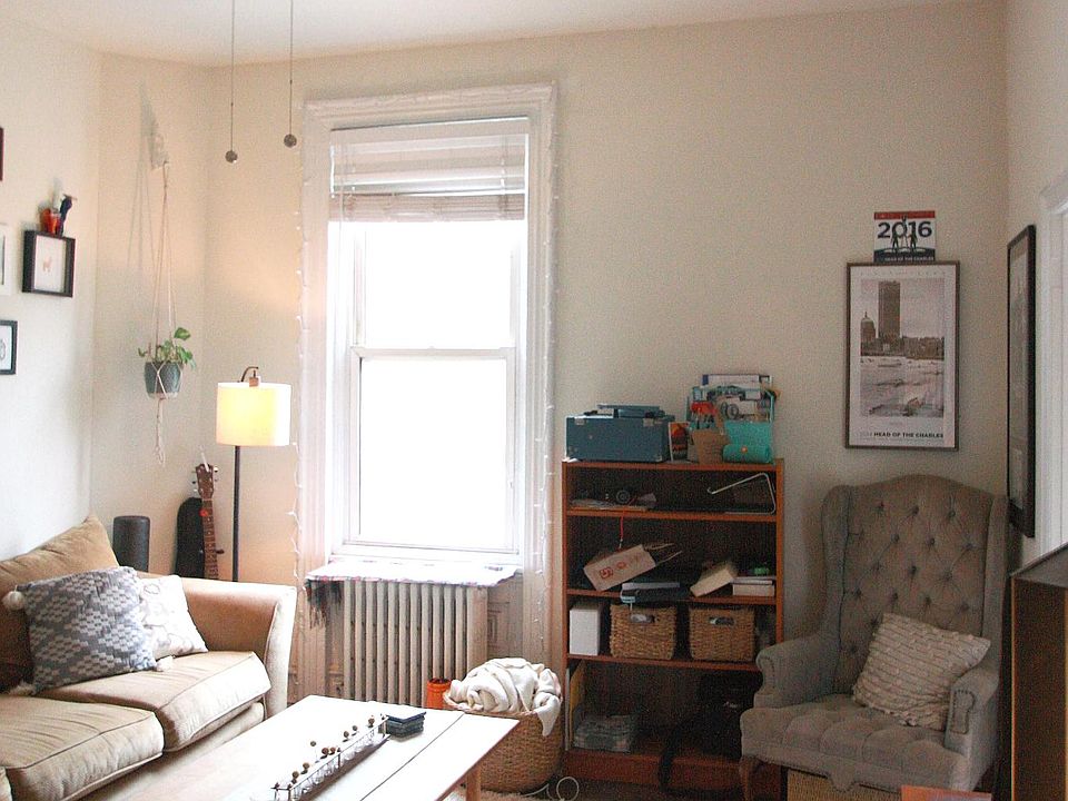 Living room with new ceiling fan, hardwood floors, and views of Pine Street