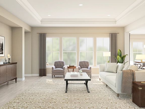 Great room with crown moulding and ceiling treatment