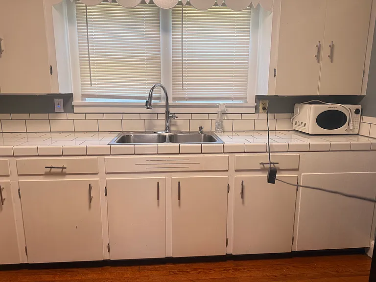 Kitchen sink and full cabinet area