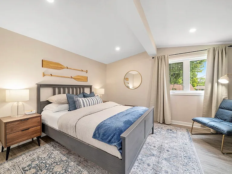 Coastal-inspired bedroom in an Ottawa midterm suite.
