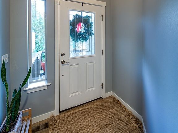 Large livingroom. Double french doors lead to very large deck