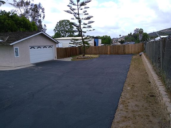 1 3/4 car garage and shop out back. Pic of straight driveway