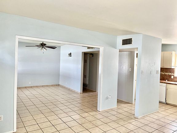 Living room opens to dining and kitchen