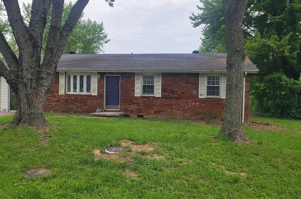 brick rancher with large front and backyard