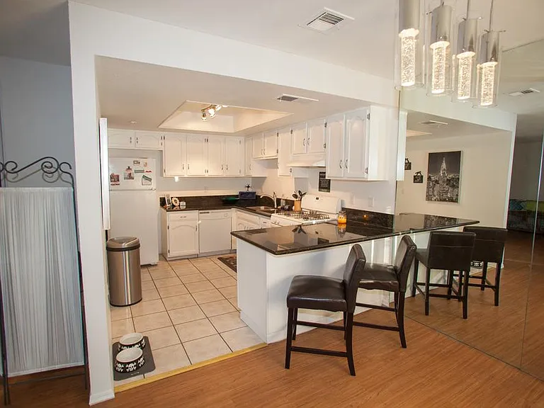 Fully remodeled kitchen with LED lighting and brand new stove. Different than the one pictured.
