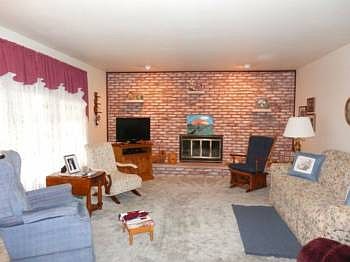Very large living room offers a gas fireplace.