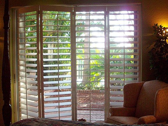 Wood Plantation Shutters on most windows