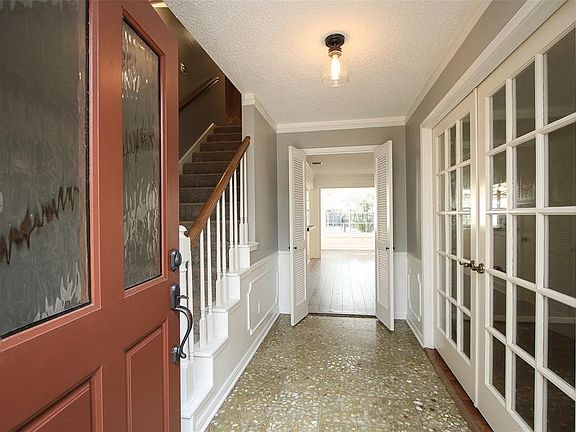 ENTRY - Nice view into the spacious home. French doors on the right lead into the formal living room.