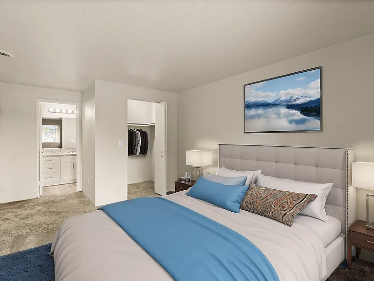 Experience tranquility in this elegantly designed bedroom with serene blue tones.