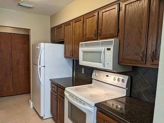 Laundry Area off of the kitchen behind bifold doors