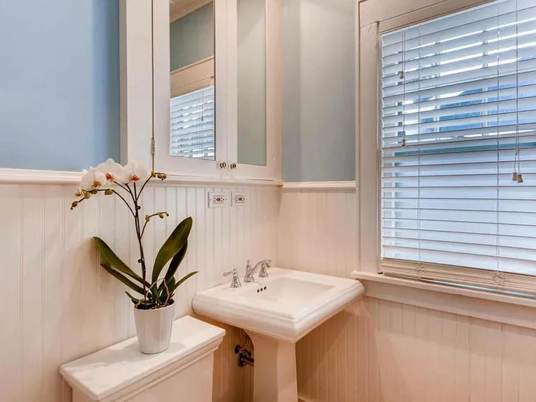 The main floor bathroom comes complete with a footed bathtub.
