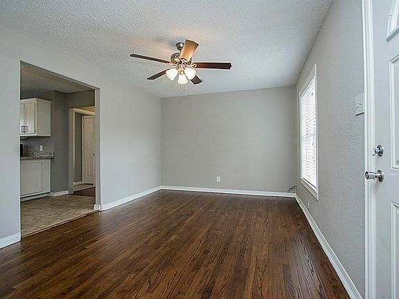 open living space with ceiling fan