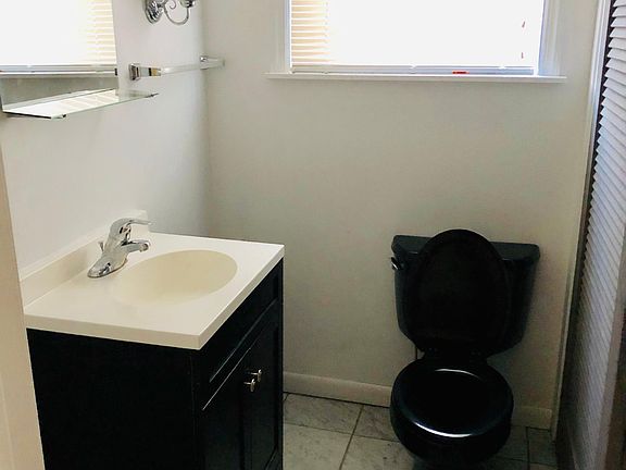 Half bathroom by the living room.