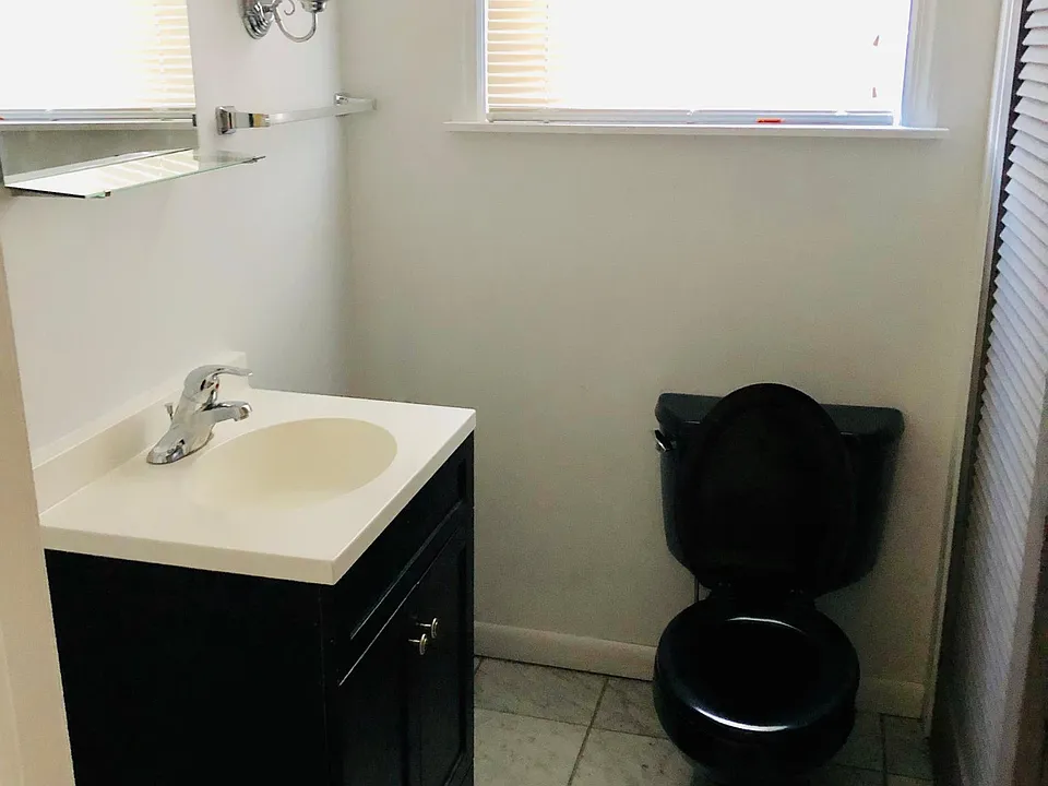 Half bathroom by the living room.